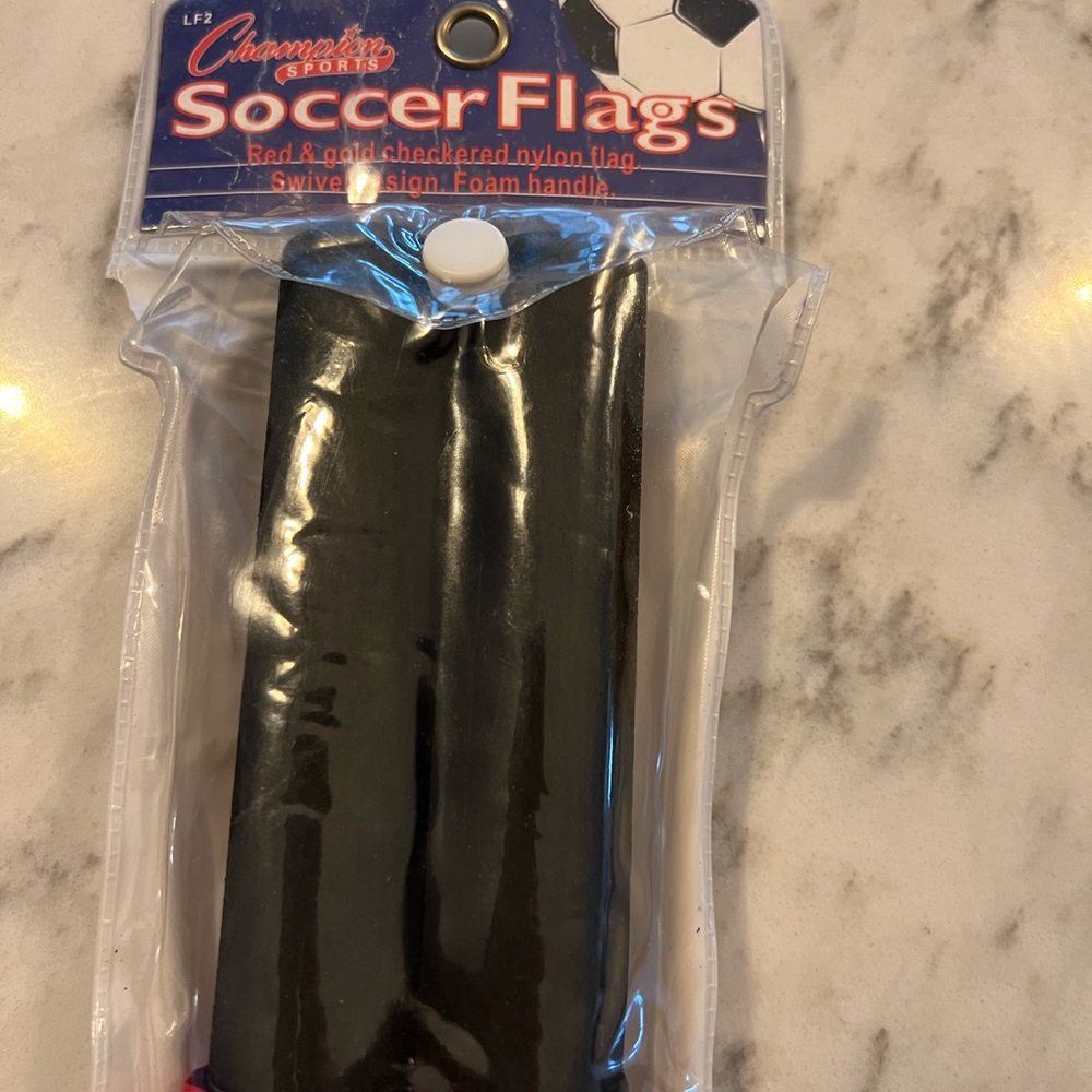 Champion checkered red and yellow soccer referee flags
